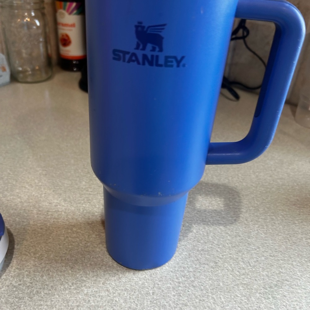 Stanley 40oz Tumbler, has a few spots but comes with the original lid and straw!